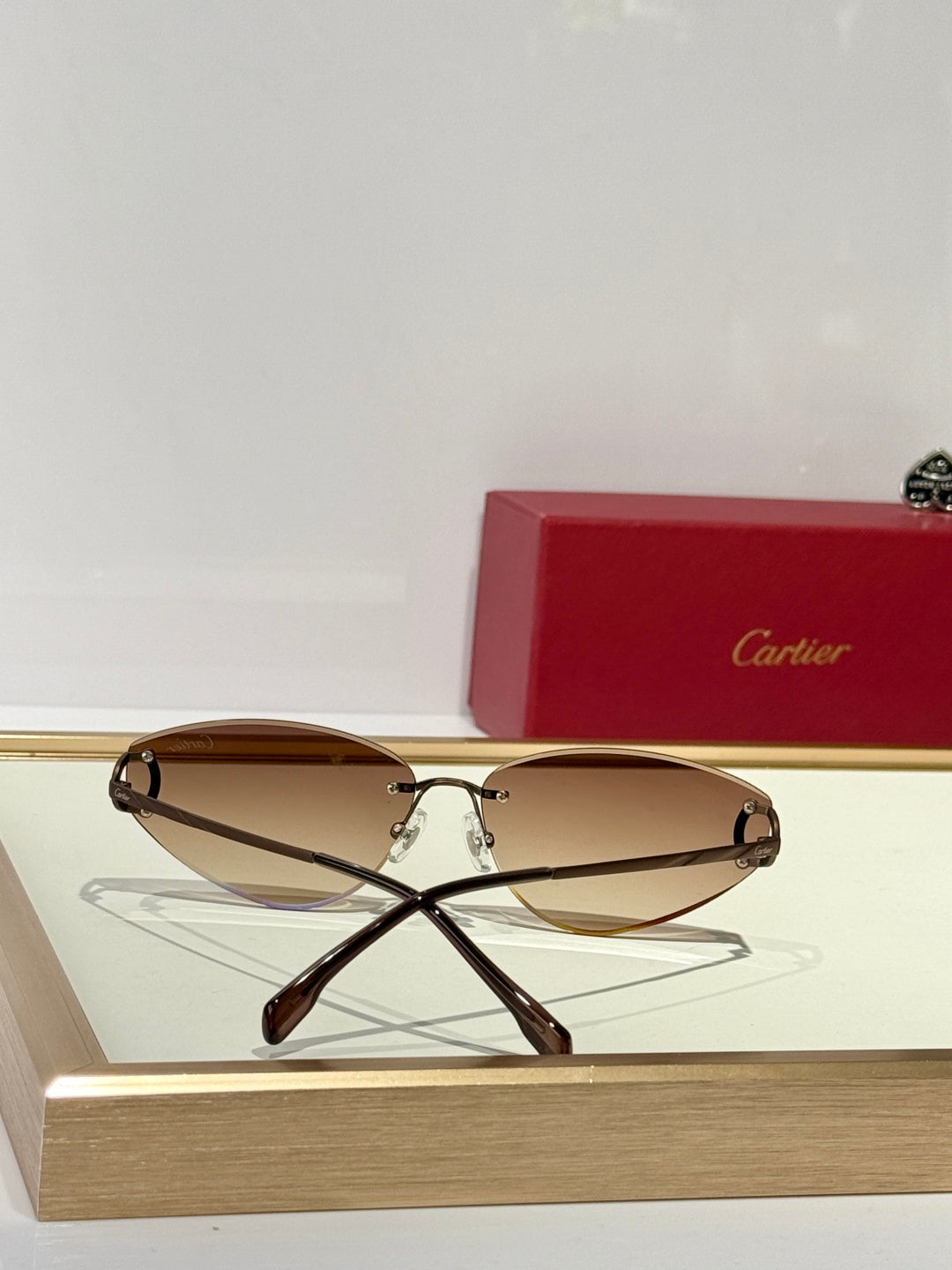 CARTIER TRIANGLE FRAME SUNGLASSES CT0334S IN METAL